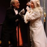 Bengtsson (l, David Sinaiko) bribes the Mummy (r, Gwyneth Richards) with a treat. Photo: Laura Mason